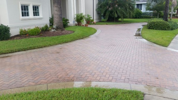 Paver driveway after pressure washing by DPI Pressure Washing & Window Cleaning LLC