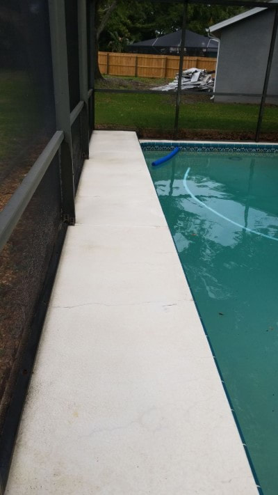 pressure washing port richey pool patio side after