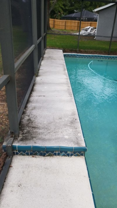 pressure washing port richey pool patio side before