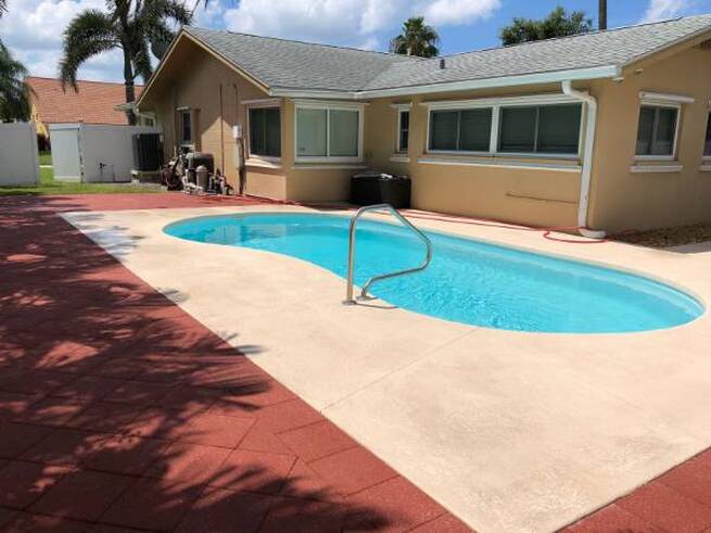pool patio, walls and roofs pressure washed
