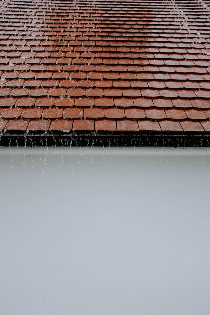 Roof showing water over gutters