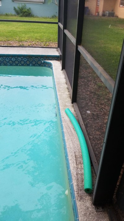 pressure washing port richey pool patio side 2 before