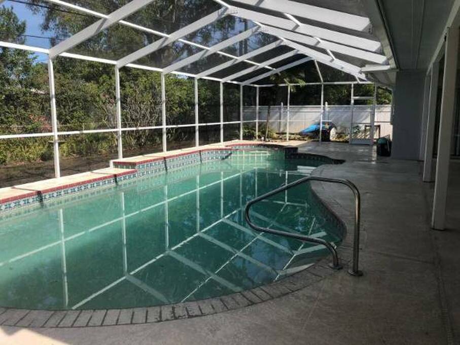 poolcage and patio after pressure washing in Clearwater, Florida
